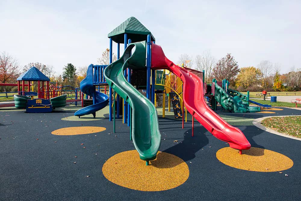 Slides and play structures at Ford Heritage Park playground