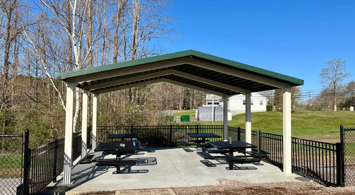 Shade pavilion with picnic tables at HOPS Playground