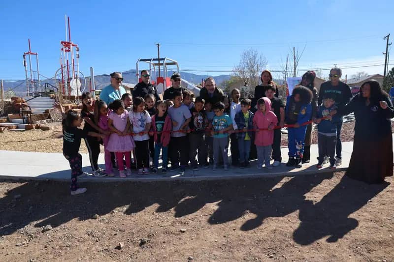 Children at the ribbon cutting near the inclusive playground at Officer Daniel Webster Memorial Children's Park in Albuquerque