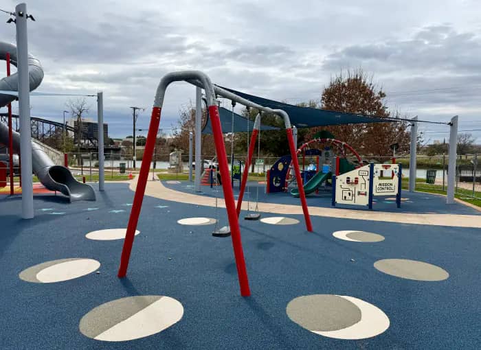 Swing set at the Bledsoe-Miller STEAM Center playground.