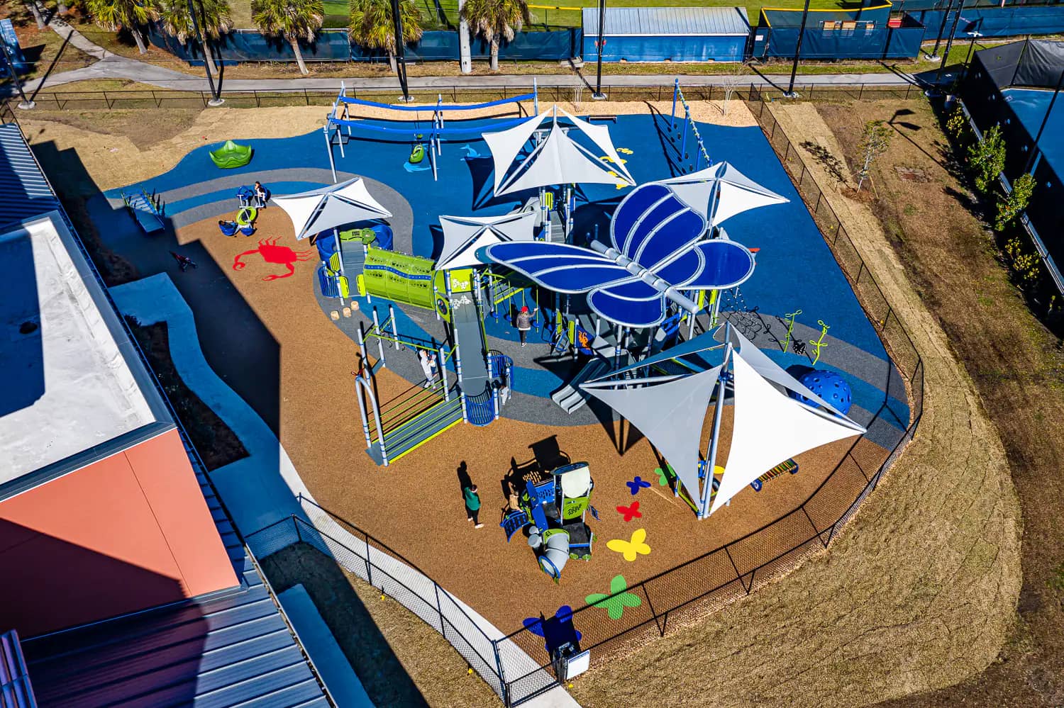 Accessible play area with colorful equipment at Gregory's Playground