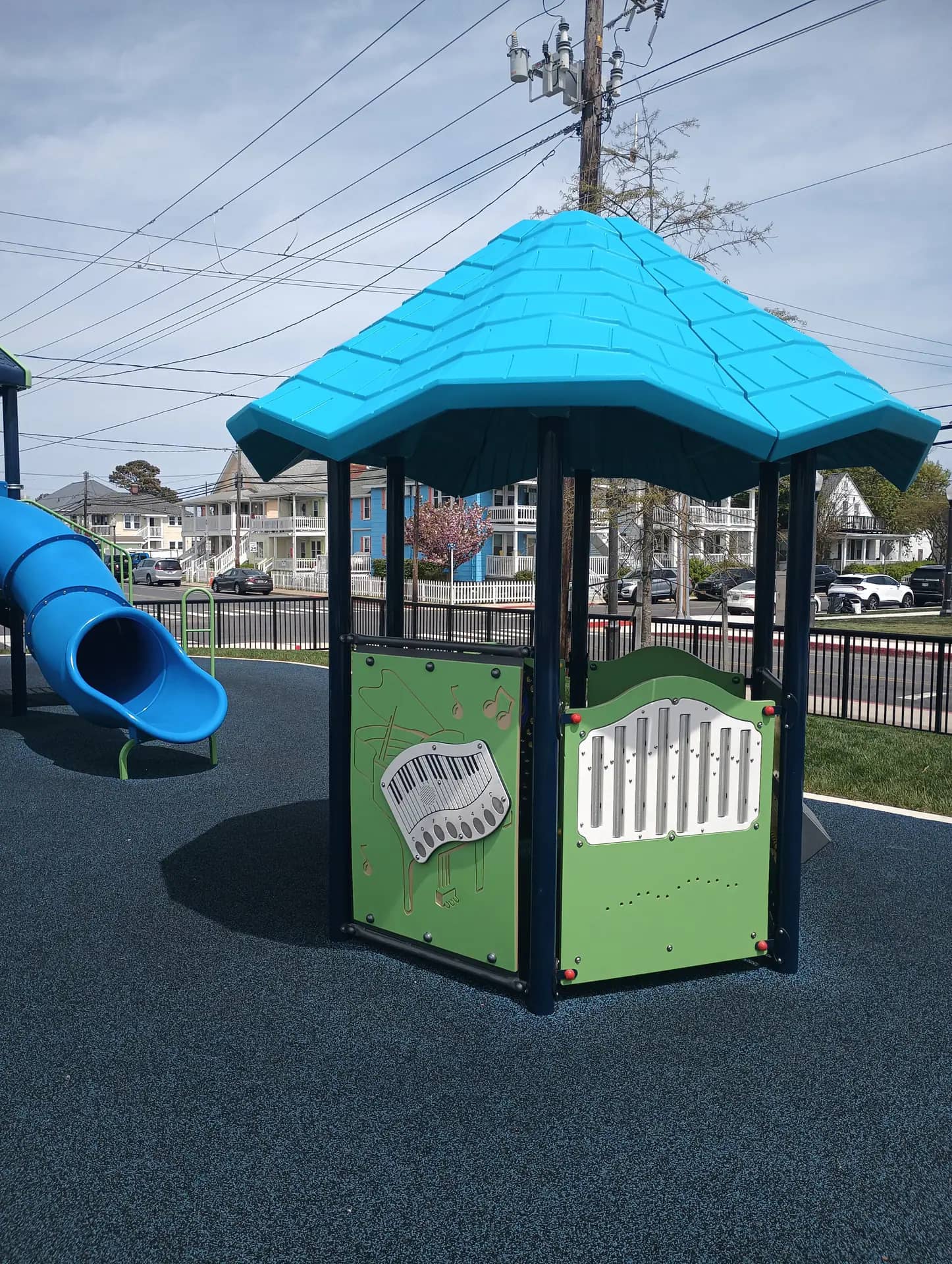 Inclusive playground structure with a rubberized surface, representative of Maryland's inclusive playground directory.