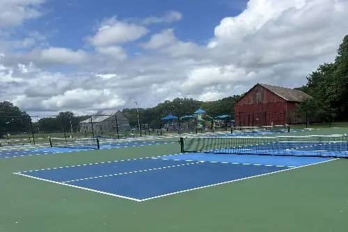 Park setting at Hallowing Point Park with courts and playground in the background.
