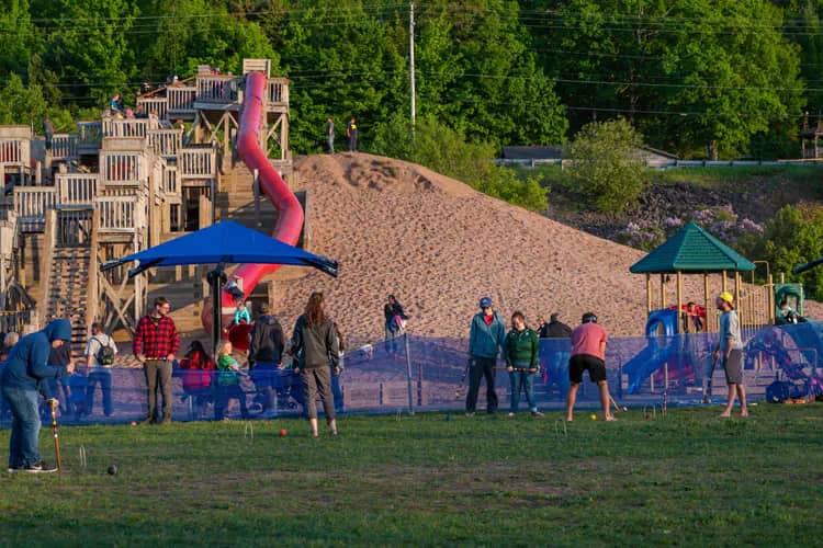 Large Chutes and Ladders waterfront playground at Kestner Waterfront Park in Houghton